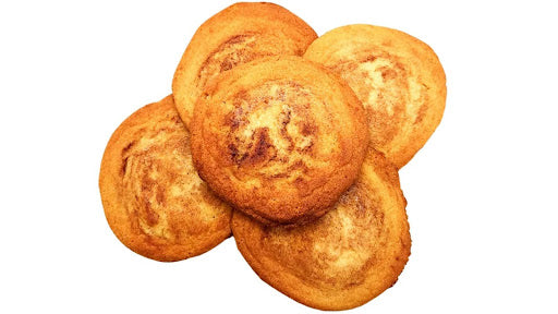 Five golden-brown baked Snickerdoodle Protein Cookies from Krack’d Snacks.