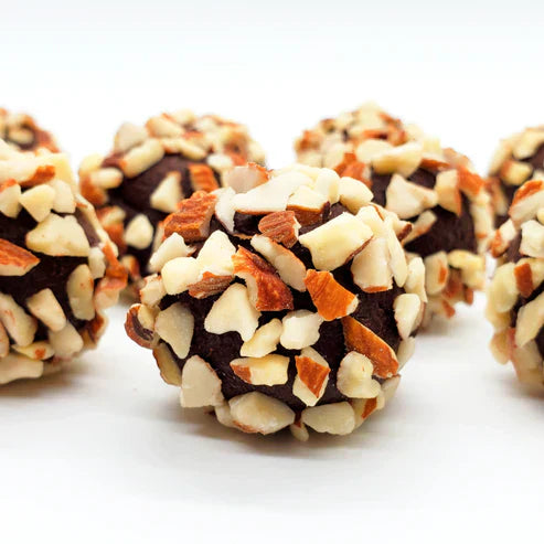 Keto chocolate truffles from Krack’d Snacks topped with chopped almonds, made with no added sugar.